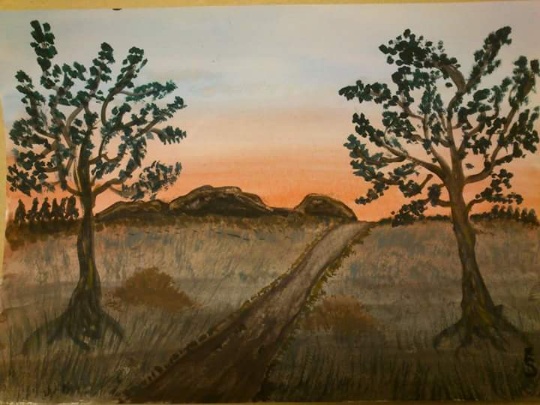 Två träd i soluppgång.